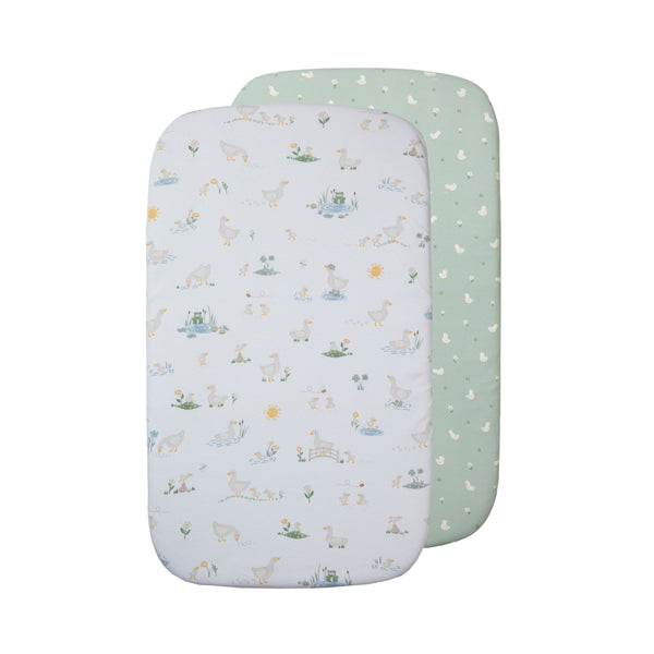 Living Textiles Goosey Goosey 2 pack organic jersey fitted sheets for bedside sleepers, one with a duck pattern and the other with a plain green design.